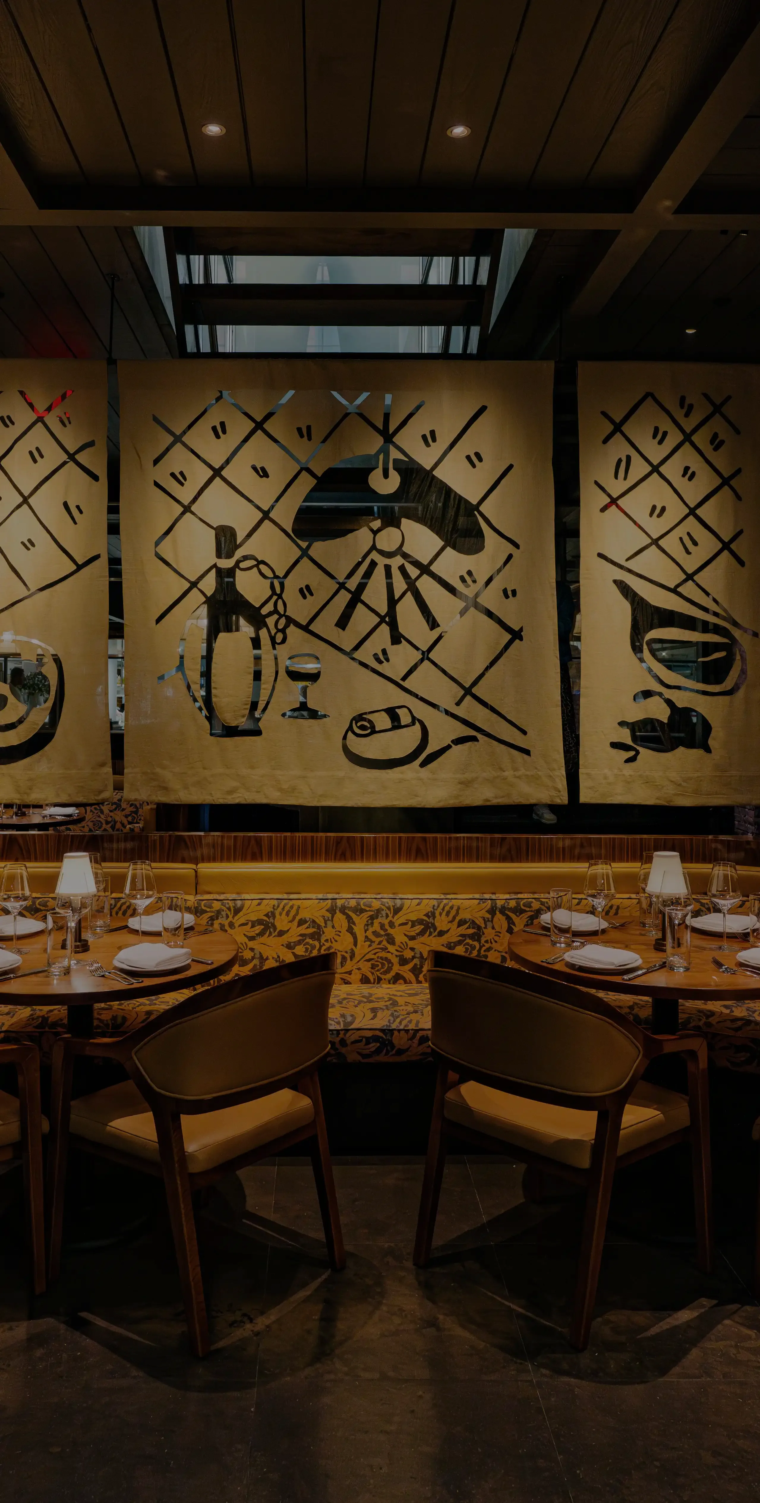 An image of the moody interior dining space at Sartiano's restaurant in New York City.